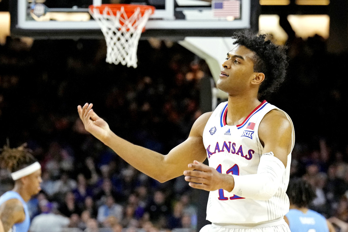 Kansas Jayhawks guard Remy Martin (11) reacts after a pay against the North Carolina Tar Heels during the 2022 NCAA men's basketball tournament Final Four championship game at Caesars Superdome.